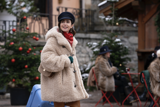 Lily Collins wears a sherpas coat and a newsboy hat