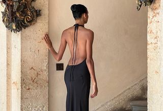 Dana Nozime wearing a black backless gown.