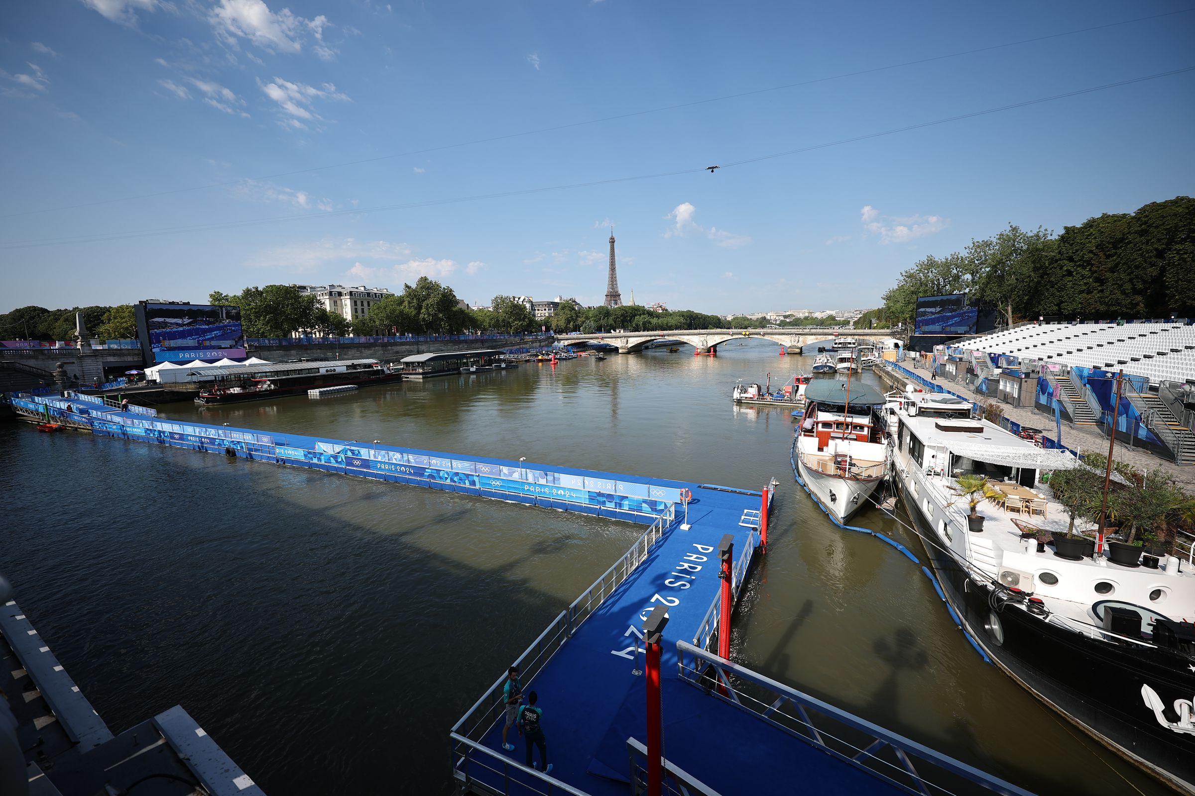 A view of the Seine with the Eiffel Tower in the background.