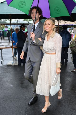 Sienna Miller wore a polka dot two-piece to Wimbledon.