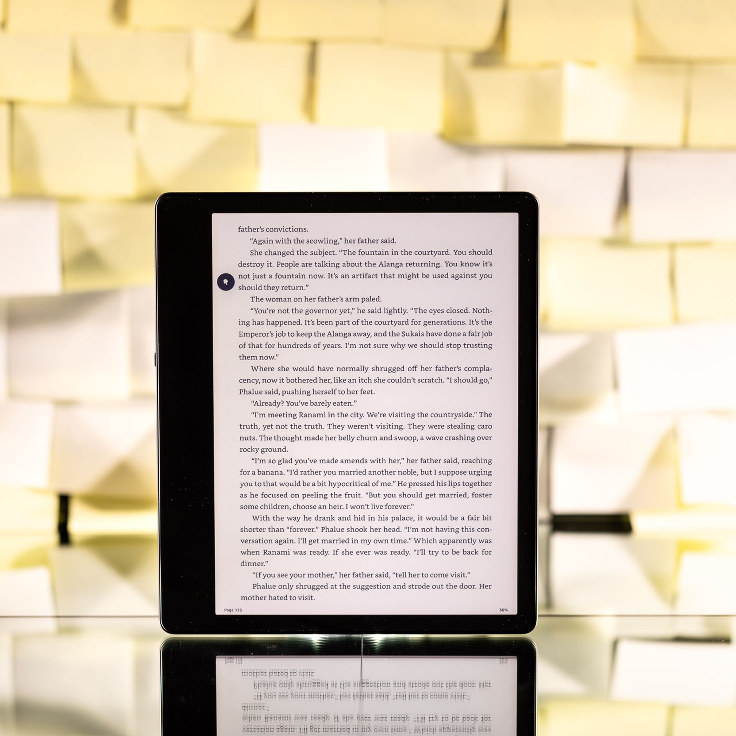 The Kindle Scribe against a background of yellow post-it notes.