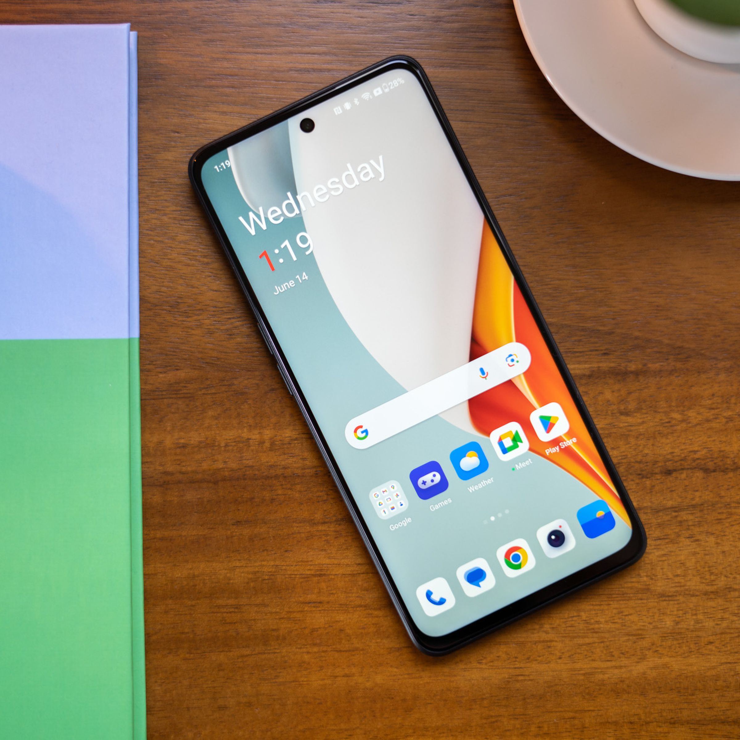 OnePlus N30 on a desk with screen facing up showing homescreen.