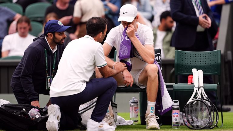 Jannik Sinner has a medical time out during his match against Daniil Medvedev on day nine of the 2024 Wimbledon Championships at the All England Lawn Tennis and Croquet Club, London. Picture date: Tuesday July 9, 2024.