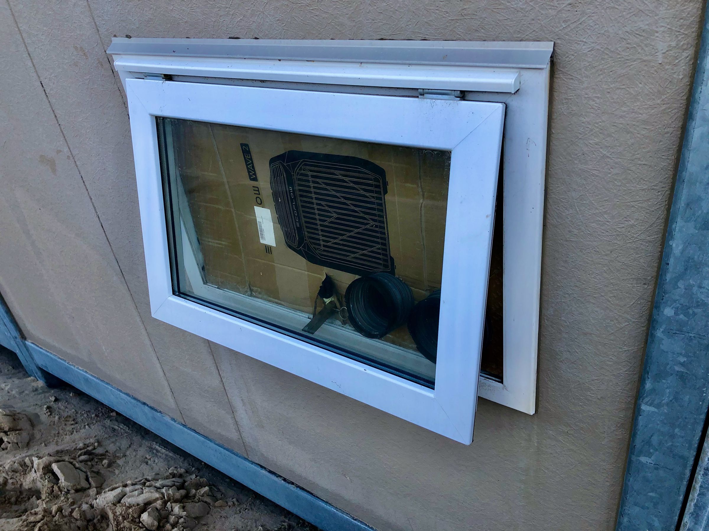 I used the Wave 2’s cardboard box and an old sarong for insulation. This large casement window is less than ideal for air flow.