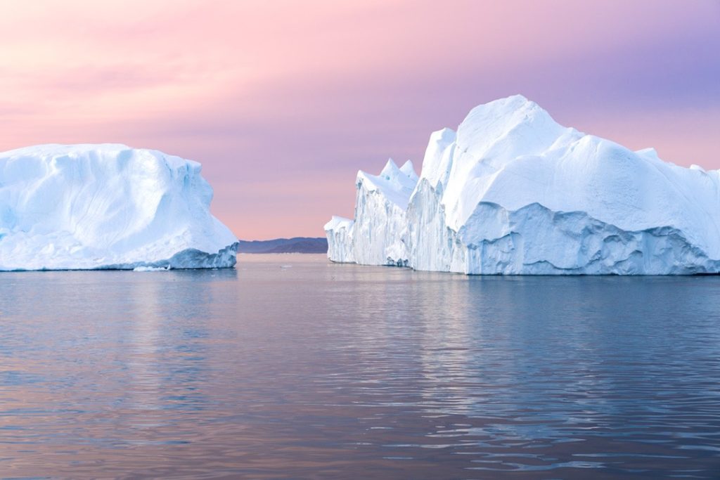 Icebergs at midnight in Ilulissat Icefjord