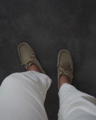 Influencer wears wallabee shoes.