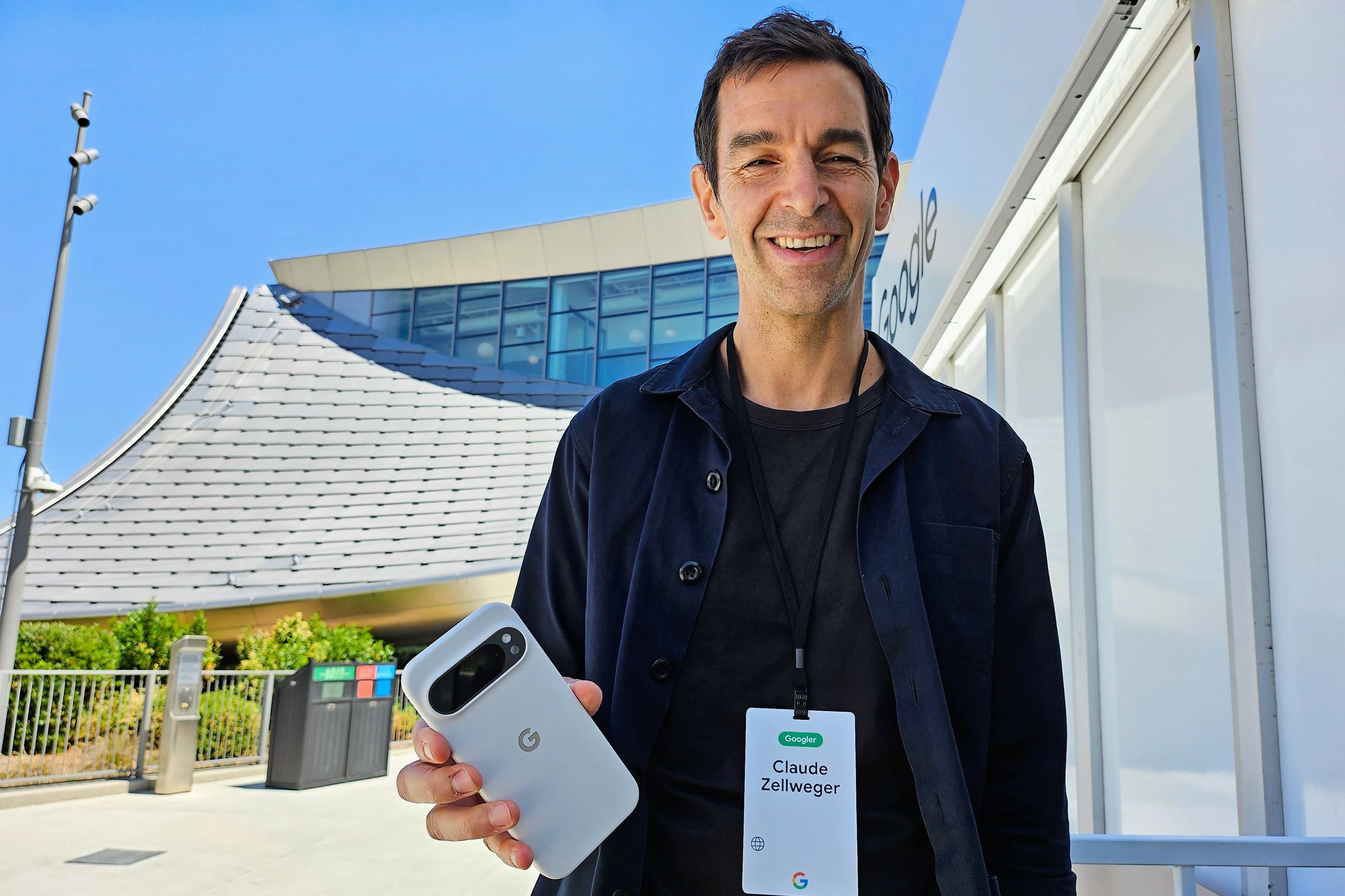 Google design director Claude Zellweger holds up a Pixel 9 series phone in a form-fitting case. “It’s the first time we’ve designed the phone and case hand in hand,” he says.