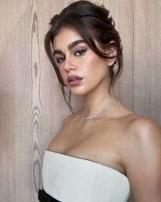 Kaia Gerber with undone updo