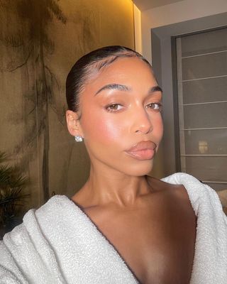 Lori Harvey wearing glass skin wedding makeup.