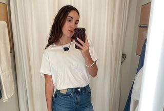 Anna LaPlaca wears a white T-shirt and wide-leg jeans from Madewell