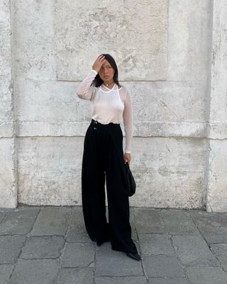 Tops that go with wide-leg trousers: @vikilefevre wears a sheer top with wide-leg trousers