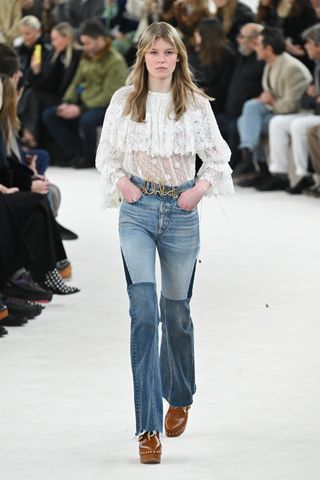 Model wears a boho blouse.