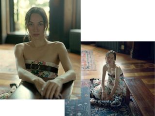 Sydney Lemmon sits on rug wearing a strapless floral dress with contrasting-print leggings.