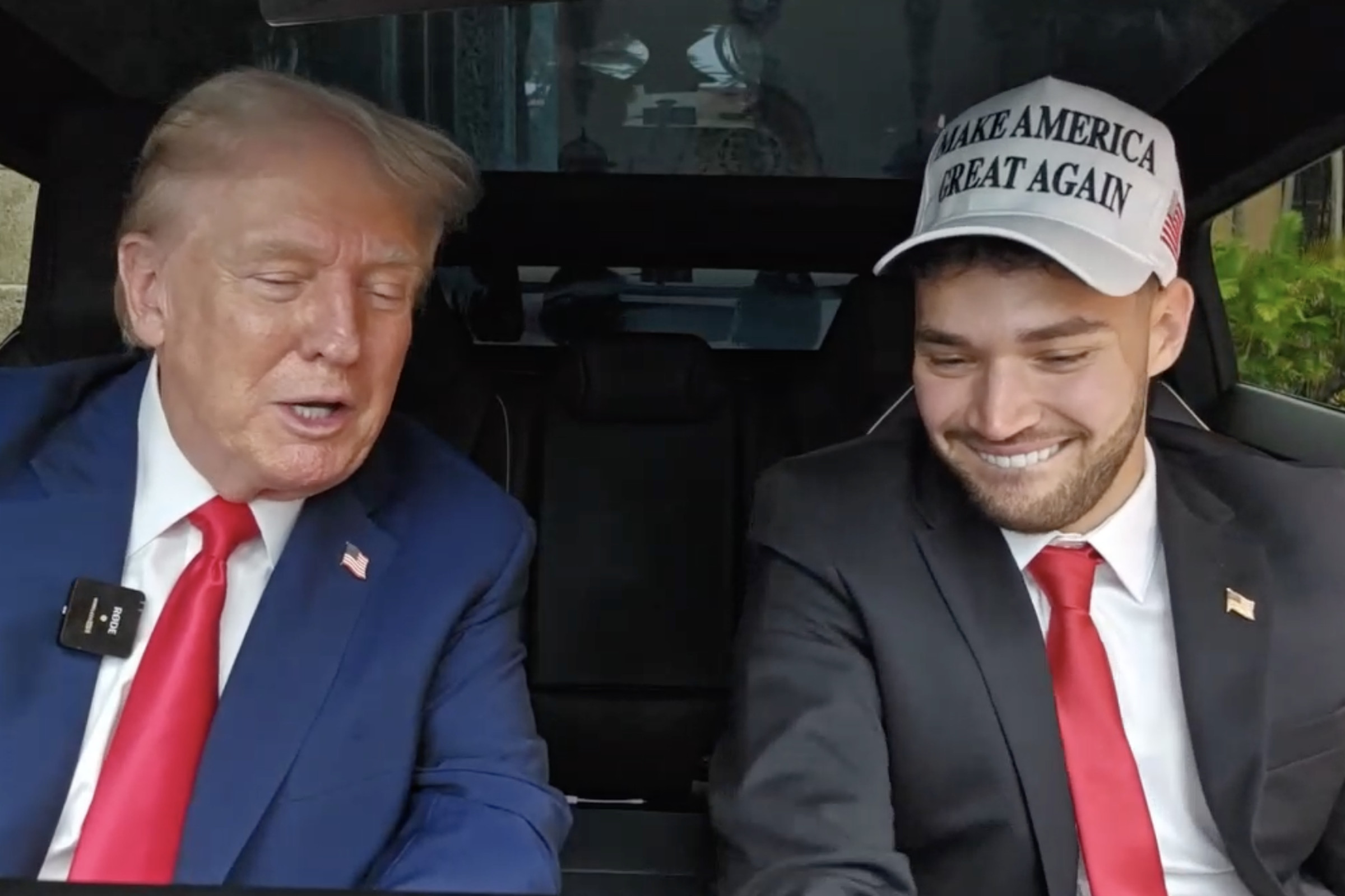 Screenshot from Kick featuring Adin Ross and Donald Trump livestreaming from the interior of a Tesla Cybertruck