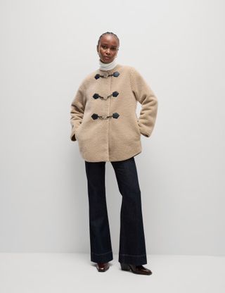 Woman wears Marks & Spencer Textured Buckle Coat