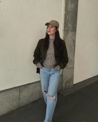 @annabelrosendahl wearing a suede bomber jacket with jeans