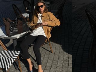 French fashion influencer Anne-Laure Mais in Paris wearing a chic fall outfit with black pants.