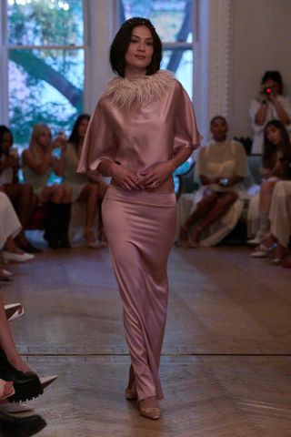 Model wears dusty rose on the Buci runway.