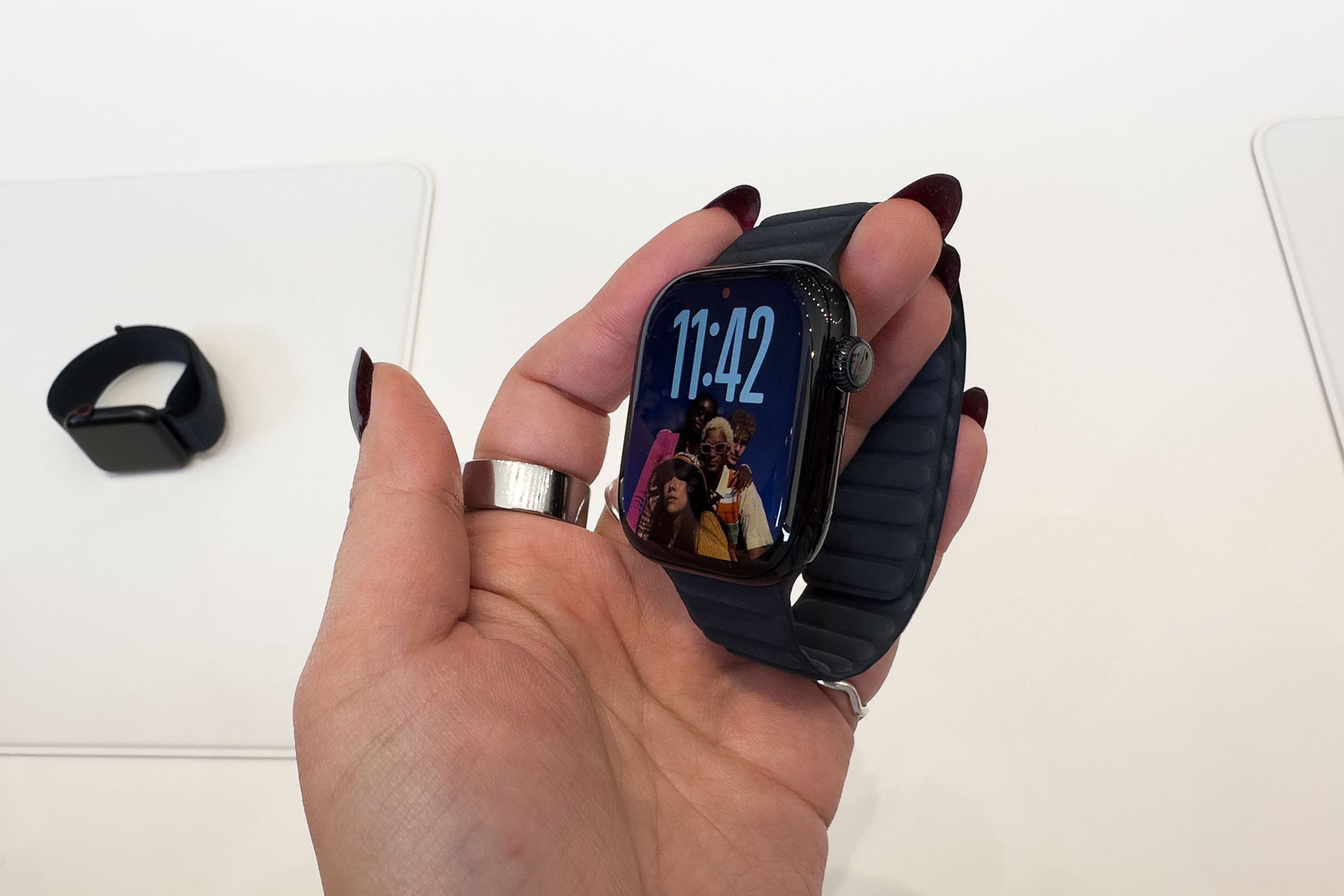 Person holding black Apple Watch series 10