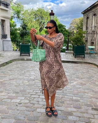 French woman wearing a leopard-print dress.