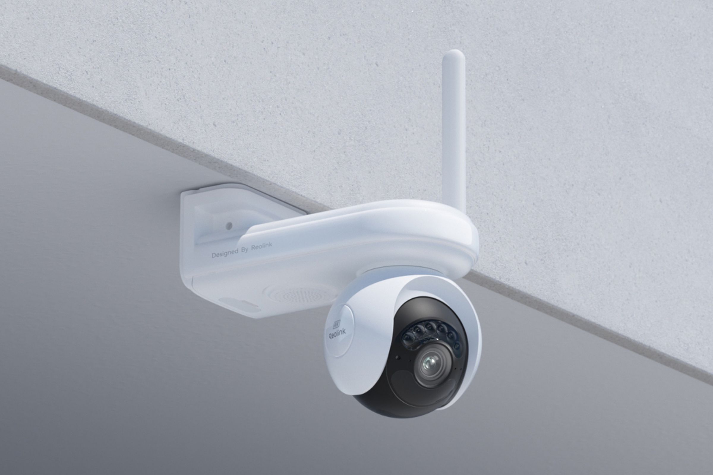 The Reolink Altas PT Ultra security camera mounted beneath the overhang of a roof.