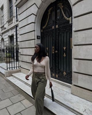 Beige cardigan and vest with green cargo trousers