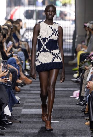 a model on the JW Anderson spring 2025 runway wearing the chunky knitwear trend