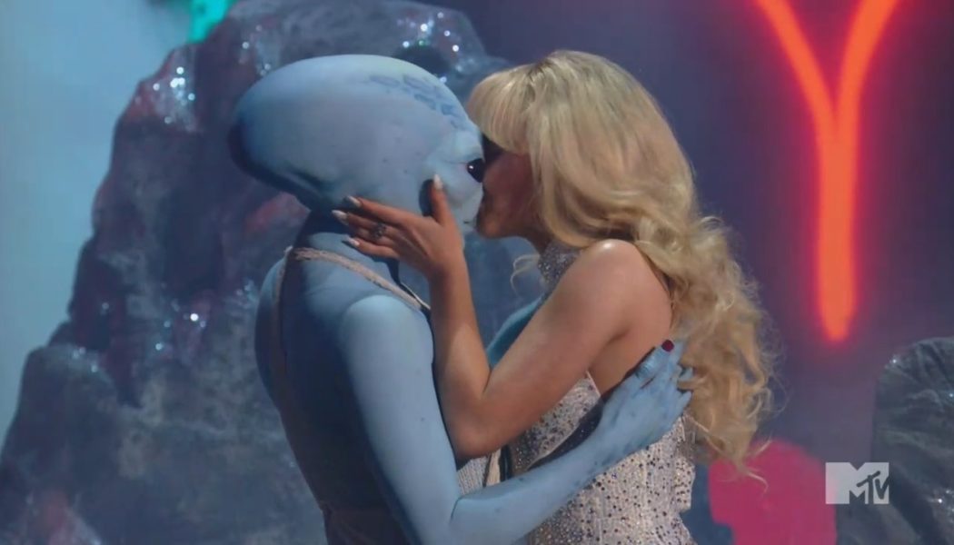 Sabrina Carpenter kisses an alien during medley performance at 2024 MTV VMAs