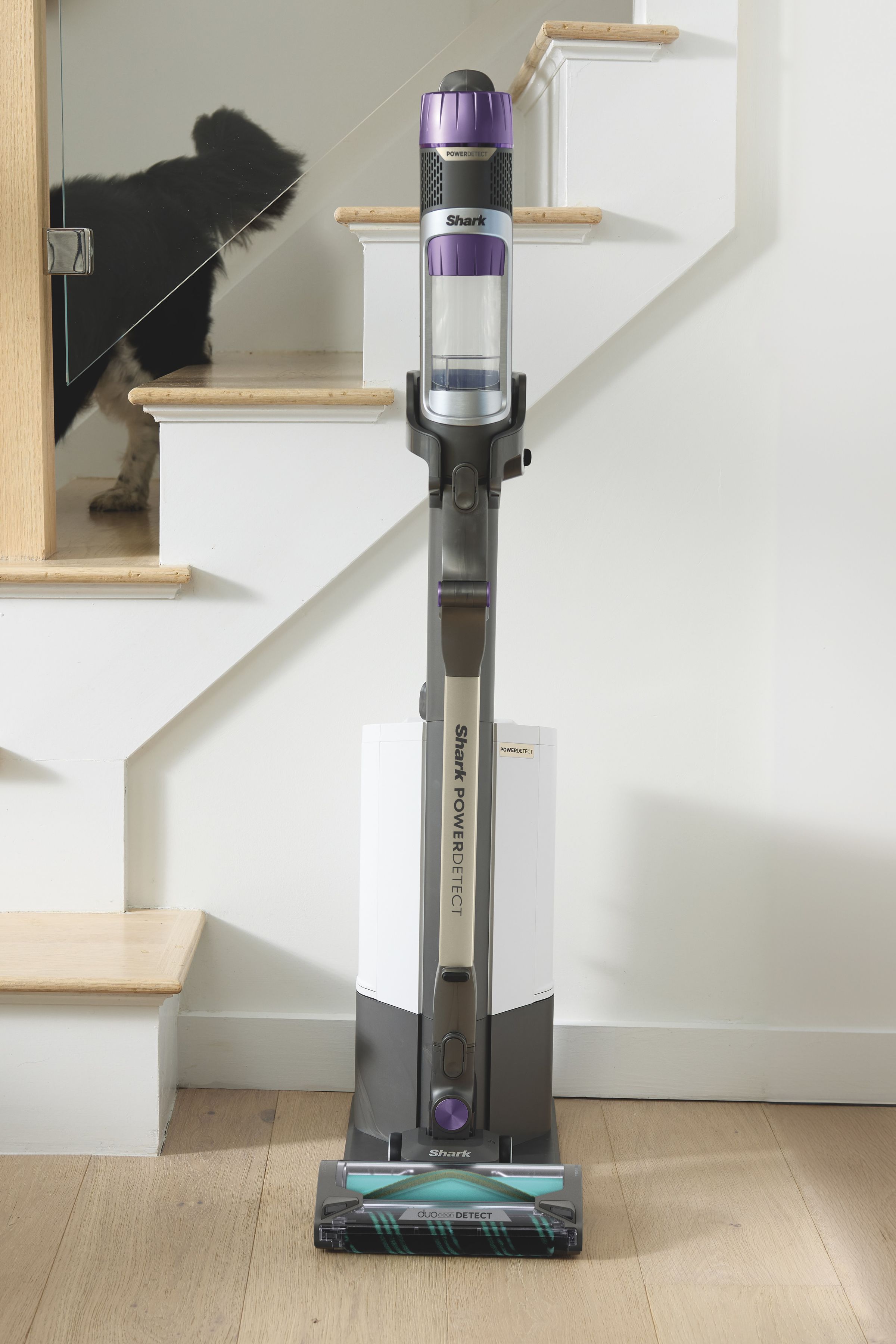 standing stick vac in front of staircase