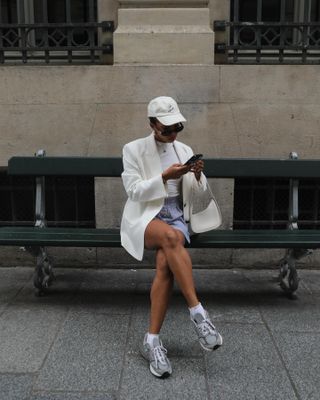 Woman wearing chunky sneakers in Paris