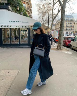 Woman wearing chunky sneakers in Paris