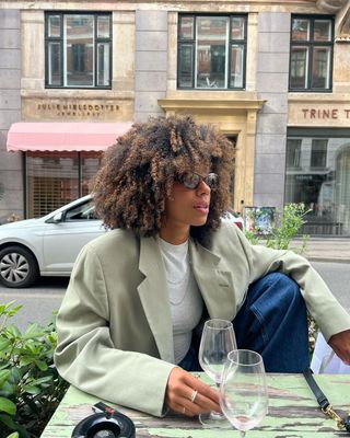 Content creator Amaka Hamelijnck poses for pictures with bouncy, full curls