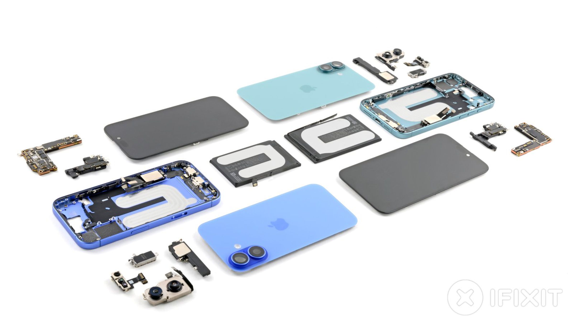 A table with the fully-disassembled iPhone 16 components laid out carefully.