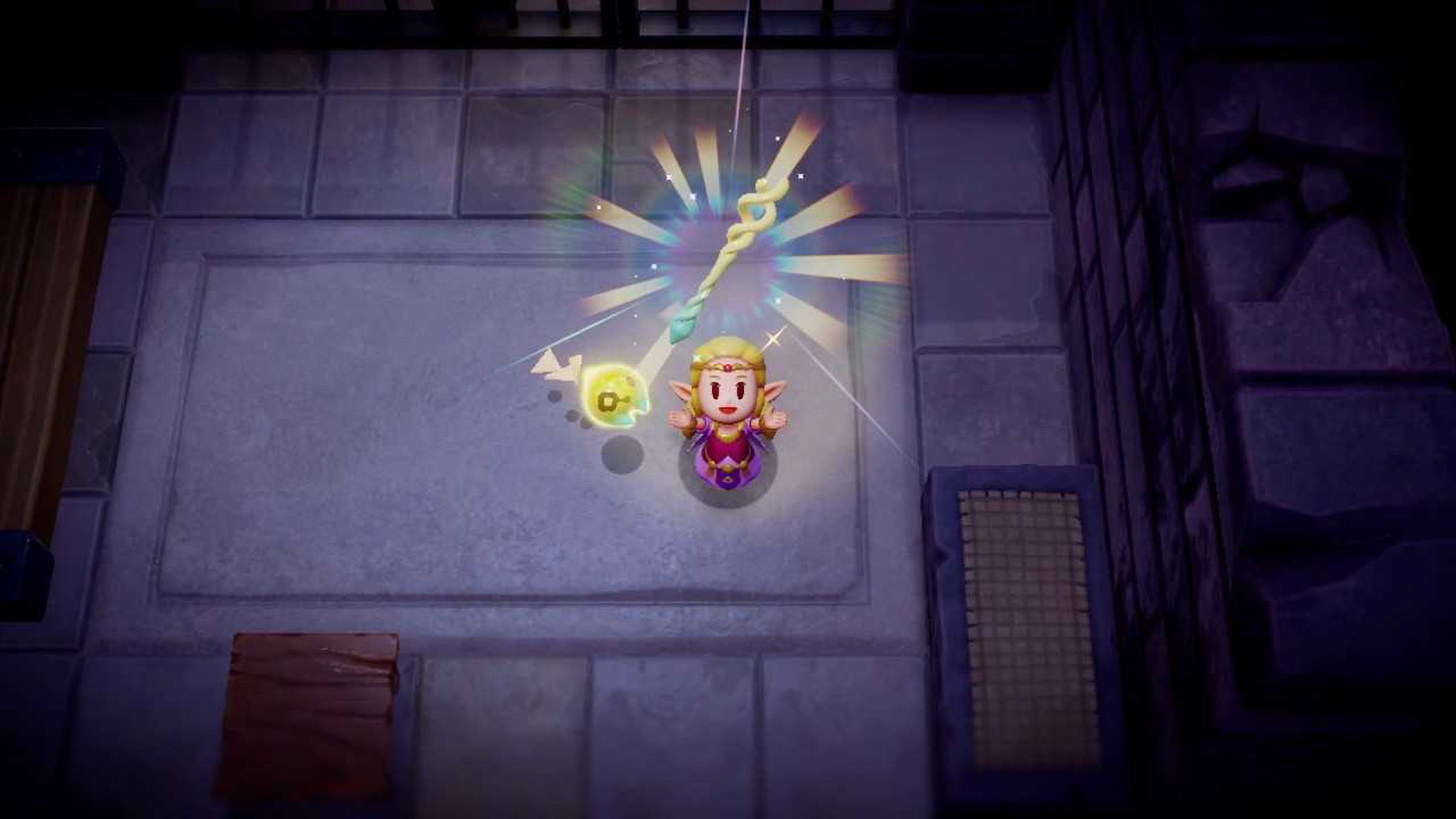 Screenshot from Echoes of Wisdom featuring Princess Zelda joyously holding up a magical staff.