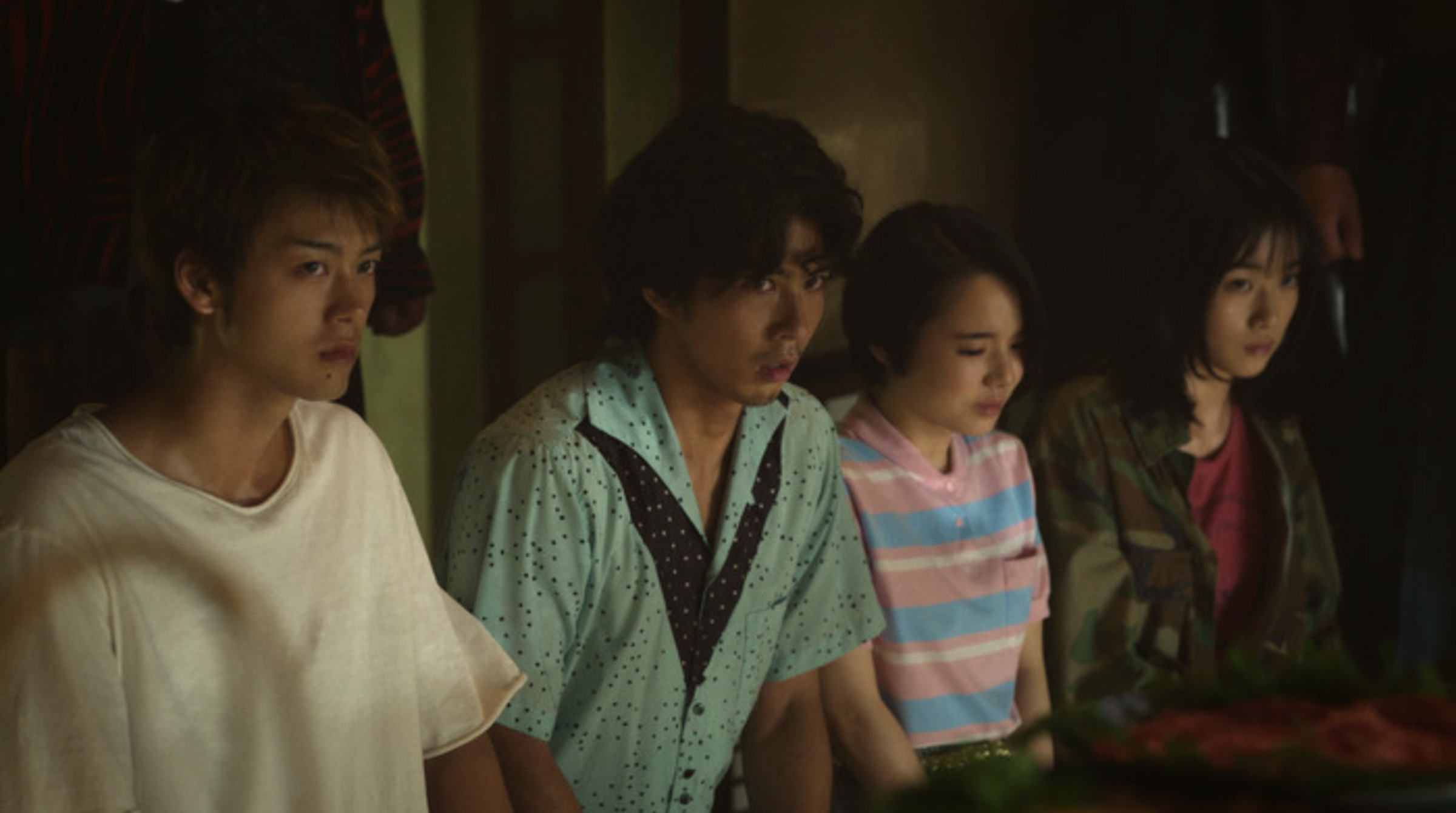 Screenshot from Like A Dragon Yakuza featuring four Japanese youths — two men and two women — kneeling anxiously.