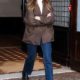 Elizabeth Olsen Hit the Airport in Winter's Richest Denim Trend and "It" Coat Color