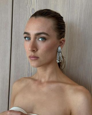 Saoirse Ronan wearing diamond earrings