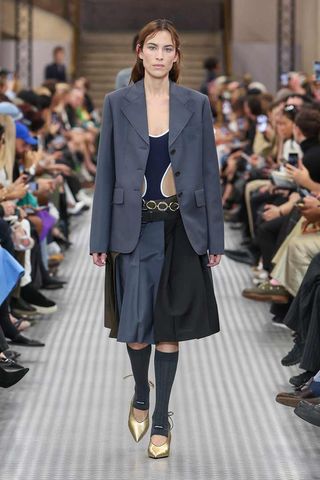 Alexa Chung walking the runway at Miu Miu's Spring/Summer 2025 Paris Fashion Week show.