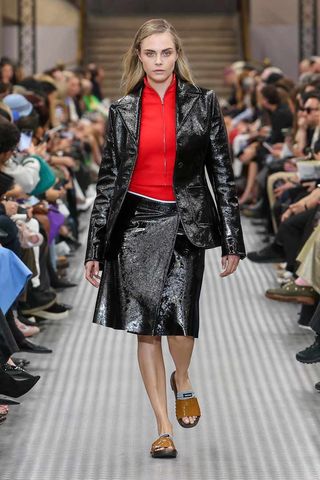 Cara Delevingne walking the runway at Miu Miu's Spring/Summer 2025 Paris Fashion Week show.