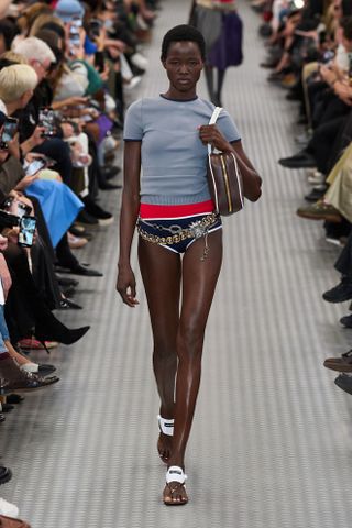 A model walking the runway at Miu Miu's Spring/Summer 2025 Paris Fashion Week show.