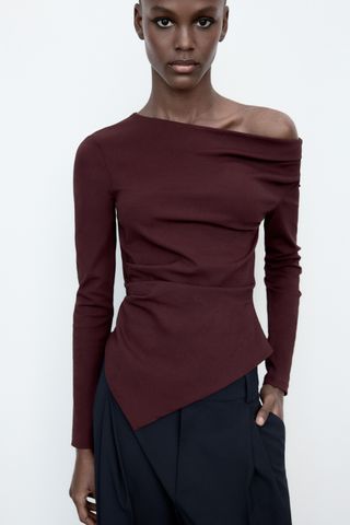 Asymmetric Stretch Top