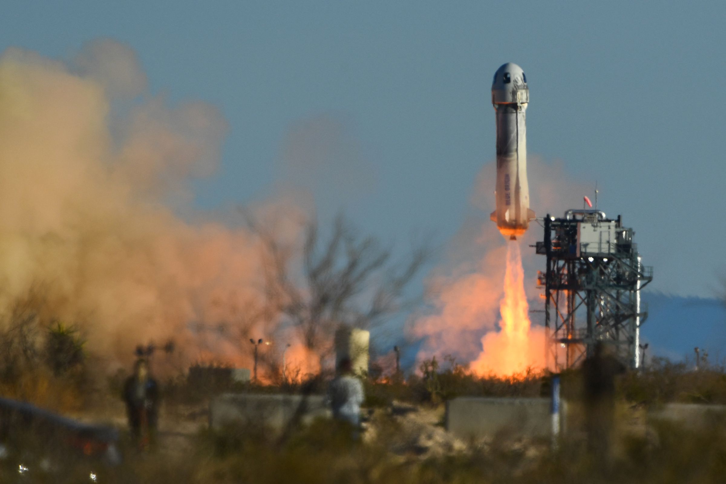 A picture of the New Shepard rocket launching.