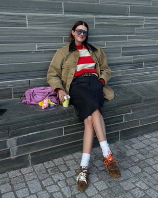 Influencer wears Miu Miu X New Balance trainers.