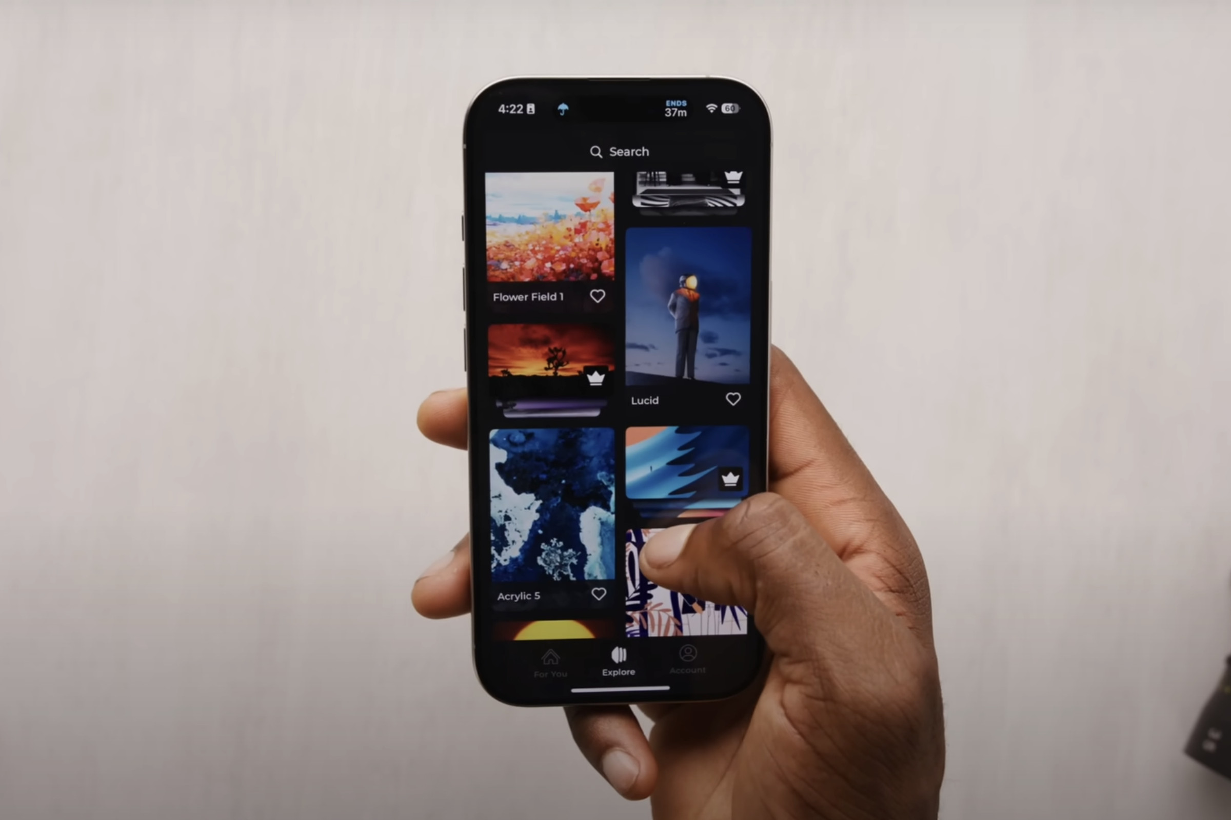 An image showing Marques Brownlee holding up a phone with the Panels app open