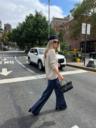 Eliza Huber wearing navy Silk Laundry silk pants