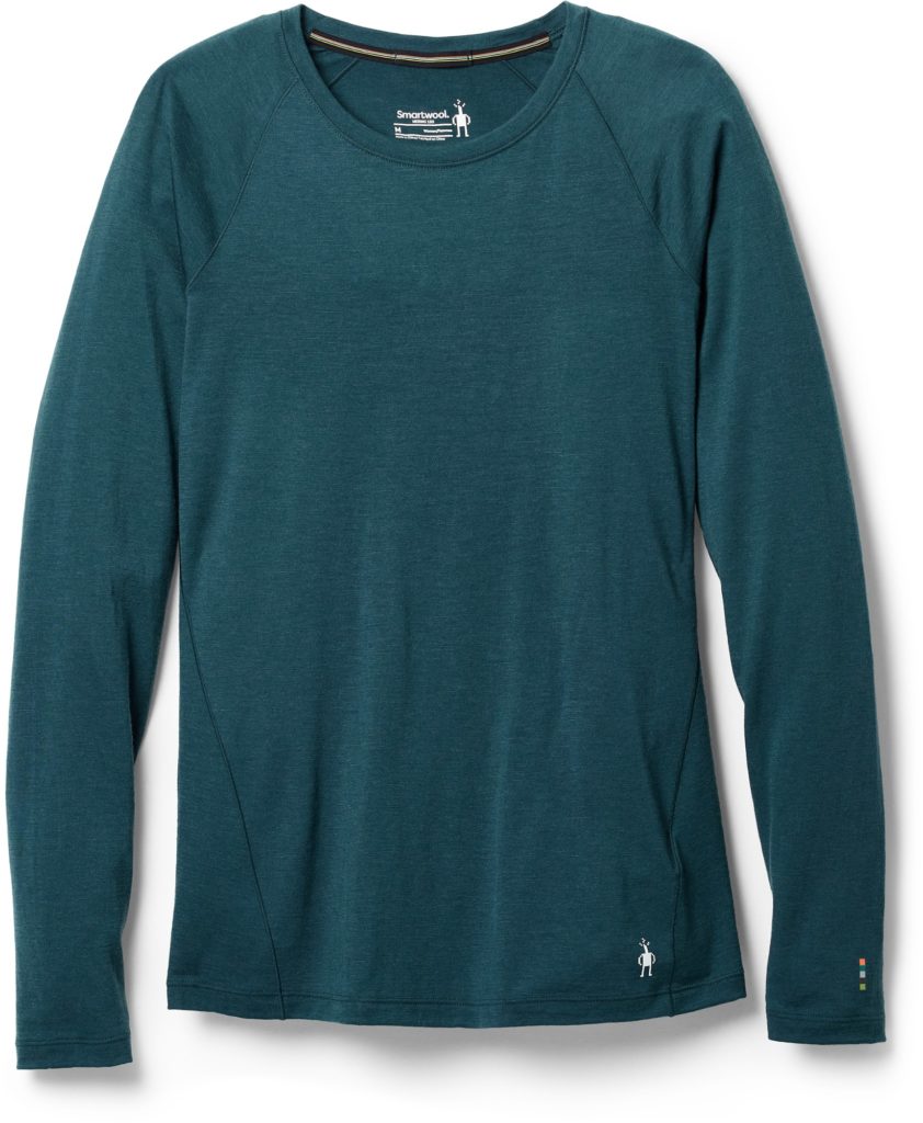 A green base layer for women, available in the REI winter sale