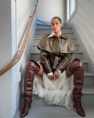 Tracee Ellis Ross wears over the knee boots.