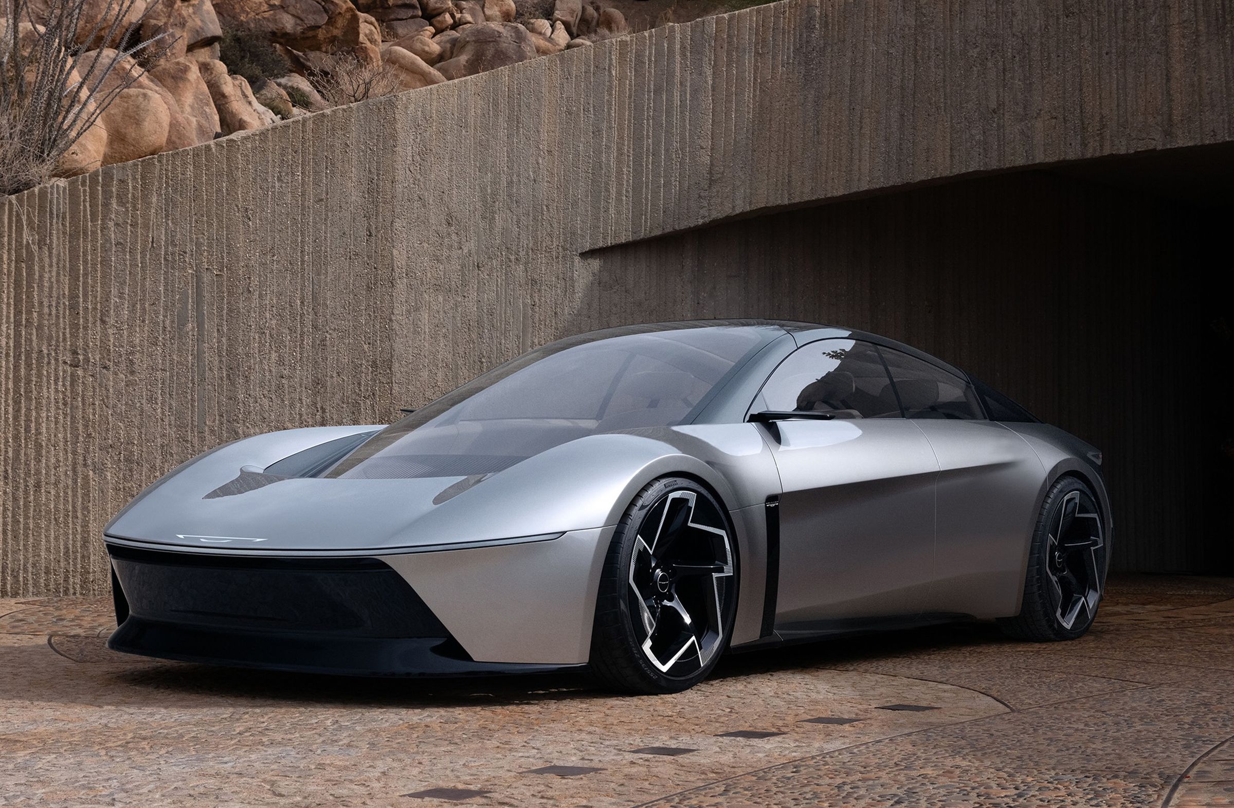 A picture of the Stellantis Halcyon concept — a curvy roadster with bubbly fenders and roofline.