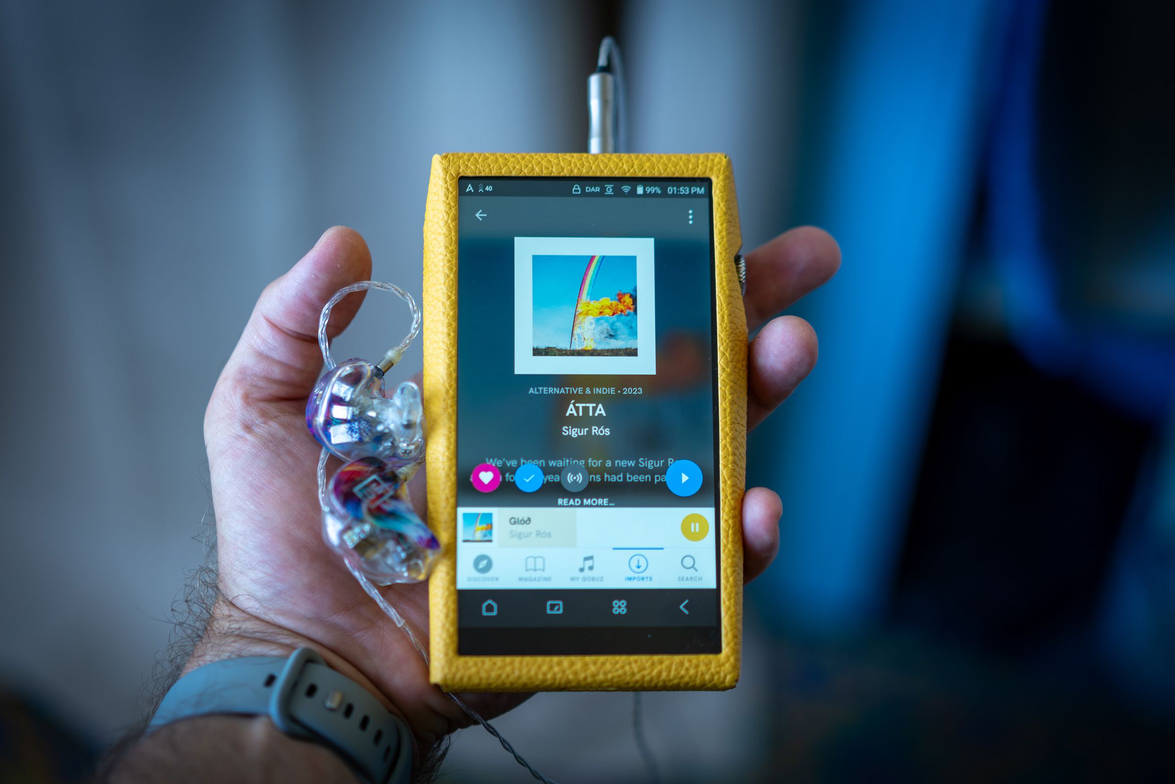 Image of Astell &amp; Kern SP3000T media player, an angular portable media player with silver edges and a red tube amp on the back. Some images show a yellow calfskin leather case.