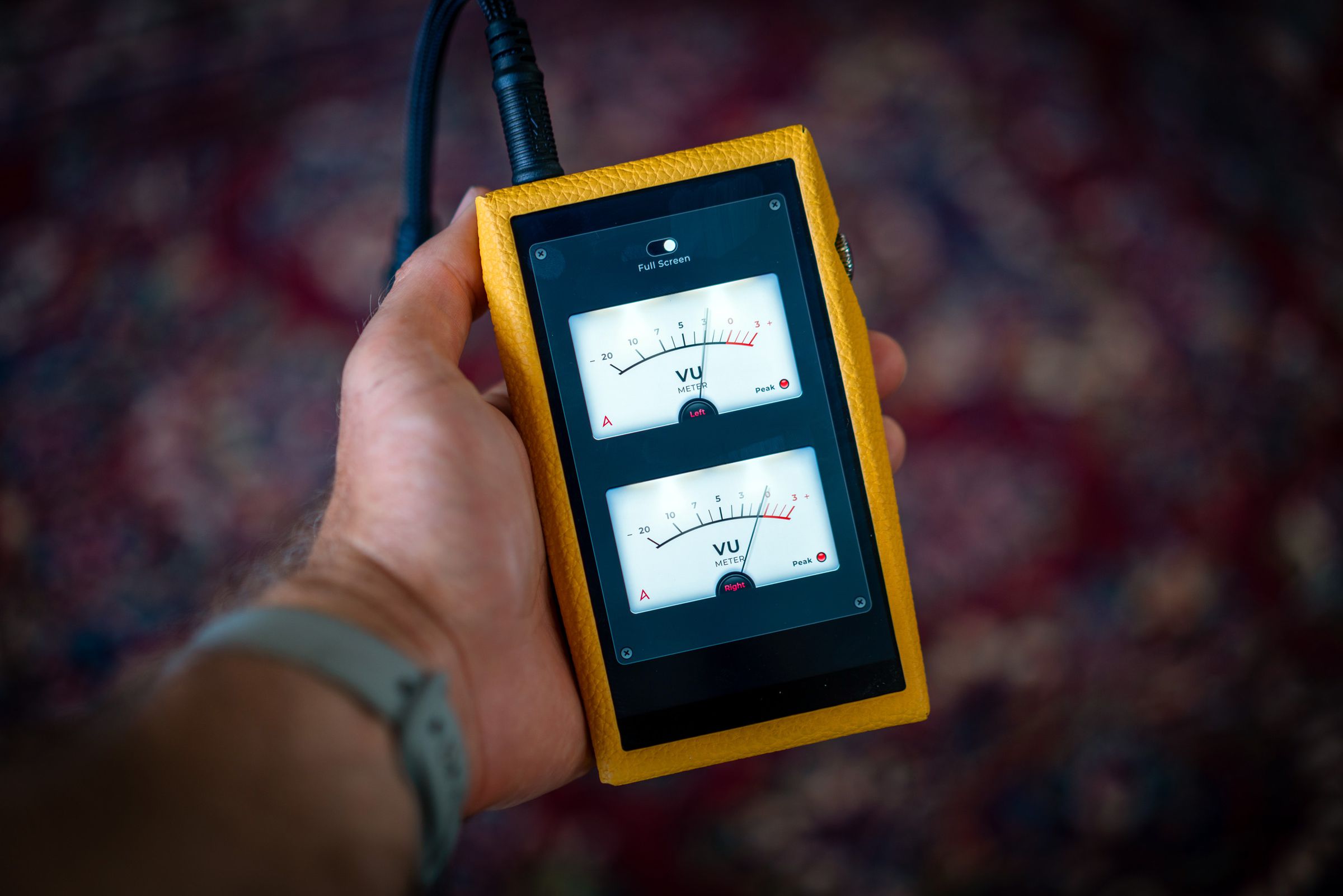 Image of Astell &amp; Kern SP3000T media player, an angular portable media player with silver edges and a red tube amp on the back. Some images show a yellow calfskin leather case.